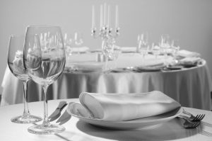 Served table in the restaurant - clean glasses, plates, forks, napkin